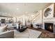 Spacious open-concept living room featuring a fireplace, staircase and eat-in kitchen at 2198 Millennium Dr # 90, Lancaster, SC 29720