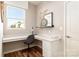 Well-lit office space featuring a built-in desk and a large window at 2198 Millennium Dr # 90, Lancaster, SC 29720