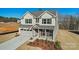 Charming two-story home featuring a two-car garage, well-manicured landscaping and a welcoming front porch at 2202 Millennium Dr # 89, Lancaster, SC 29720