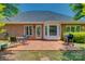 Spacious backyard with brick patio, dining set, and lush greenery at 2289 Veery Ln, Rock Hill, SC 29732