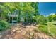 Tranquil backyard with a swing, pergola and cozy seating area around a fire pit at 2289 Veery Ln, Rock Hill, SC 29732
