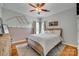 Charming bedroom with wooden bed frame, neutral walls, and decorative bear artwork at 2289 Veery Ln, Rock Hill, SC 29732
