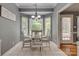 The cozy dining area features bay windows and a modern chandelier, perfect for intimate gatherings at 2289 Veery Ln, Rock Hill, SC 29732