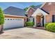 A well-manicured lawn accents this brick home with a two car garage at 2289 Veery Ln, Rock Hill, SC 29732
