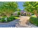 Charming brick home with well-maintained landscaping, mature trees, and a spacious driveway at 2289 Veery Ln, Rock Hill, SC 29732