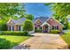 Charming brick home with manicured landscaping and a well-maintained lawn on a sunny day at 2289 Veery Ln, Rock Hill, SC 29732
