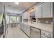 Bright kitchen with white cabinets, modern stainless steel appliances, and an adjoining dining area at 2289 Veery Ln, Rock Hill, SC 29732