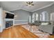 Spacious living room with hardwood floors, fireplace, and comfortable gray sectional sofa at 2289 Veery Ln, Rock Hill, SC 29732