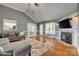 Spacious living room with hardwood floors, vaulted ceiling, fireplace, and natural light at 2289 Veery Ln, Rock Hill, SC 29732