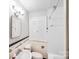 Clean bathroom featuring neutral tile, a vanity and shower at 2405 Greenland Ave, Charlotte, NC 28208
