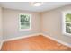 Neutral bedroom with two windows allowing for natural light at 2405 Greenland Ave, Charlotte, NC 28208