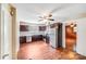 Well-lit kitchen with stainless appliances, dark wood cabinetry, and ceiling fan at 2405 Greenland Ave, Charlotte, NC 28208