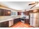 Well-lit kitchen with stainless appliances, dark wood cabinetry, and modern countertops at 2405 Greenland Ave, Charlotte, NC 28208