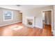 Bright living room featuring a fireplace and hardwood floors at 2405 Greenland Ave, Charlotte, NC 28208