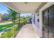 Front porch with iron railing providing a welcoming entry to the home at 2405 Greenland Ave, Charlotte, NC 28208