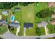 Aerial view of home, outbuilding, pool, and expansive yard at 2610 Fairgreen Dr, Gastonia, NC 28056
