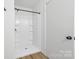 This bathroom features a white shower with black hardware and new fixtures at 2610 Fairgreen Dr, Gastonia, NC 28056