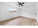 Bedroom with wood-look floors, ceiling fan, closet, and window at 2610 Fairgreen Dr, Gastonia, NC 28056