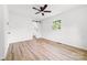 This bedroom boasts hardwood floors, a ceiling fan, and a modern barn door to the bathroom at 2610 Fairgreen Dr, Gastonia, NC 28056