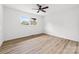 This bedroom has hardwood floors, a ceiling fan, and one window for light at 2610 Fairgreen Dr, Gastonia, NC 28056
