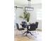 Dining room with a modern light fixture, round table, and sliding barn door at 2610 Fairgreen Dr, Gastonia, NC 28056