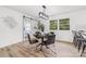 Dining room with a modern light fixture, a dark round table, and access to the kitchen at 2610 Fairgreen Dr, Gastonia, NC 28056