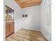 Entryway with wood door, wood-look floors and accent ceiling at 2610 Fairgreen Dr, Gastonia, NC 28056