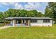 Charming, renovated ranch home with a lovely, welcoming front yard and a brick exterior at 2610 Fairgreen Dr, Gastonia, NC 28056