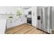 Modern kitchen showcasing white cabinets, subway tile backsplash, and stainless steel appliances at 2610 Fairgreen Dr, Gastonia, NC 28056