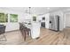 Contemporary kitchen boasts white cabinets, quartz counters, and stainless steel appliances at 2610 Fairgreen Dr, Gastonia, NC 28056