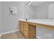 Bathroom includes a vanity with drawers and a large mirror, and neutral paint at 280 Glenn Allen Rd, Mooresville, NC 28115