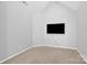 Minimalist bedroom with neutral walls, carpeted floors, and a wall-mounted TV at 280 Glenn Allen Rd, Mooresville, NC 28115