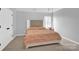Bedroom featuring neutral colors, a swing chair, and carpet flooring at 280 Glenn Allen Rd, Mooresville, NC 28115