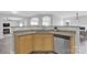 Spacious kitchen with granite countertops, stainless steel sink and a view into the dining and living areas at 280 Glenn Allen Rd, Mooresville, NC 28115