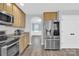 Well-equipped kitchen featuring stainless steel appliances, plenty of cabinet space, and stylish wood-look flooring at 280 Glenn Allen Rd, Mooresville, NC 28115