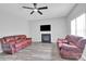 Inviting living room with gray walls, a fireplace, and comfortable seating arrangement at 280 Glenn Allen Rd, Mooresville, NC 28115