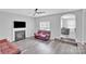 Warm living room with gray walls, a fireplace, and comfortable seating, perfect for relaxation at 280 Glenn Allen Rd, Mooresville, NC 28115
