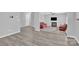 Open-concept living room with a fireplace, neutral walls, and durable flooring throughout at 280 Glenn Allen Rd, Mooresville, NC 28115