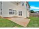 Back patio offers an excellent outdoor living space with a door to the indoors at 280 Glenn Allen Rd, Mooresville, NC 28115