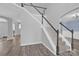 Elegant staircase with wood-look floors, leading to the upper level of the house with natural light at 280 Glenn Allen Rd, Mooresville, NC 28115