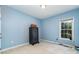 Well-lit bedroom features an interesting security safe with a window bringing the outdoors in at 2909 Arbor Knl, Concord, NC 28025