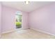 Cozy bedroom with a large window letting in natural light, creating a warm and inviting space at 2909 Arbor Knl, Concord, NC 28025