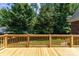 Large wooden deck overlooks the green backyard at 2909 Arbor Knl, Concord, NC 28025