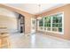 Sunny dining area with pendant lighting, large windows, and easy access to the deck at 2909 Arbor Knl, Concord, NC 28025