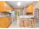 Bright kitchen with stainless steel appliances, granite countertops, and breakfast bar with seating at 2909 Arbor Knl, Concord, NC 28025