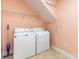 Cozy laundry room complete with a washer and dryer, and overhead shelving at 2909 Arbor Knl, Concord, NC 28025