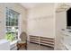 Bright walk-in closet with natural light, organized shelving, and ample space for storage at 2909 Arbor Knl, Concord, NC 28025