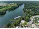 Stunning aerial view of the community pool and boat dock on the serene waters at 298 Bridges Farm Rd, Mooresville, NC 28115