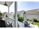 Charming back porch with patio seating and string lights for relaxed outdoor enjoyment at 298 Bridges Farm Rd, Mooresville, NC 28115