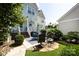 Landscaped backyard features a patio area perfect for outdoor dining and relaxation at 298 Bridges Farm Rd, Mooresville, NC 28115